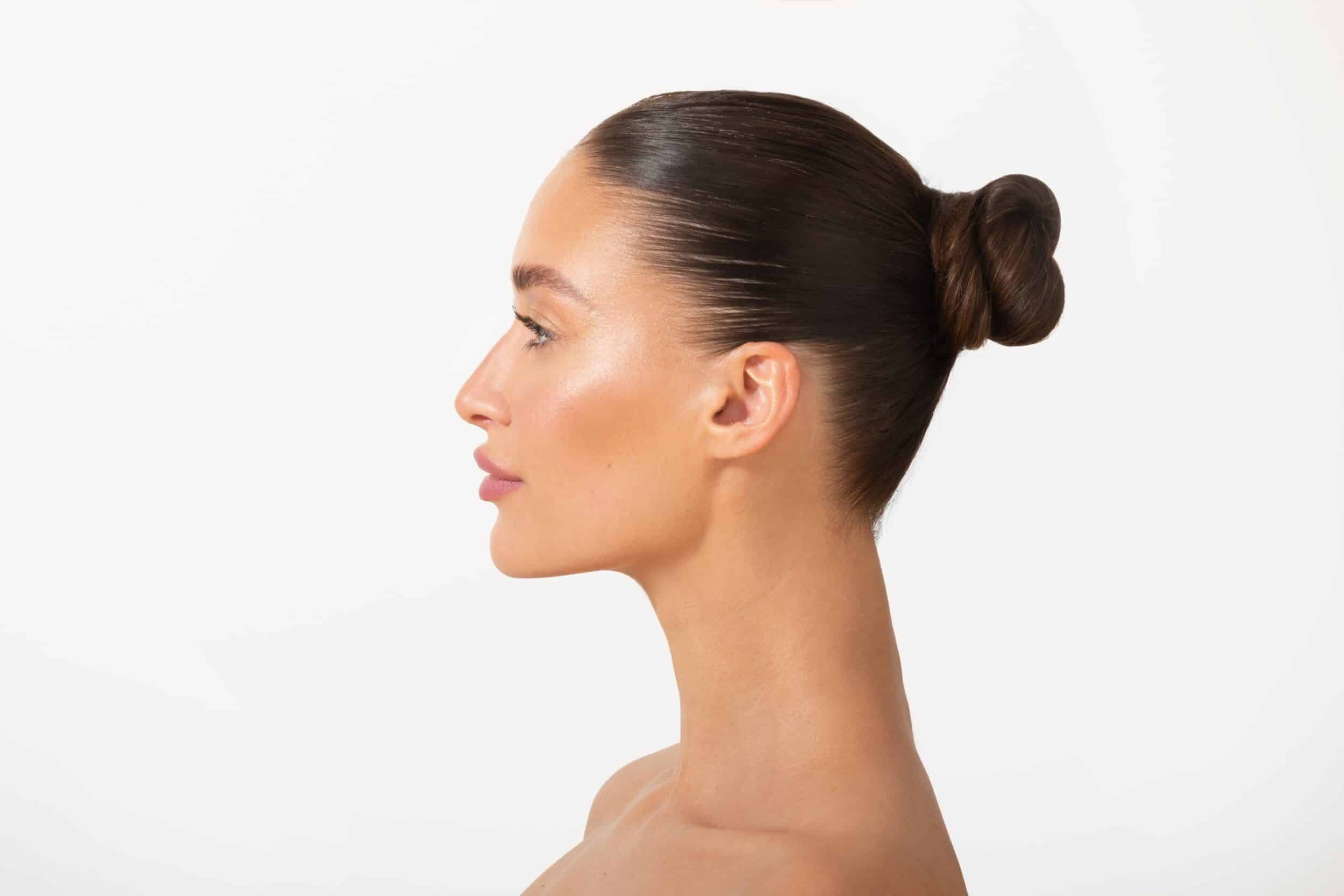 A profile shot of a woman after rhinoplasty in Lewisville, TX